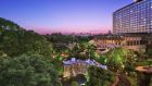 Exterior Hotel New Otani Tokyo with waterfall, park and city views