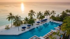 See more information about Emerald Faarufushi Resort & Spa beach sunset