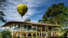 See more information about Hacienda Bambusa Hacienda exterior with Hot air balloon in the skies
