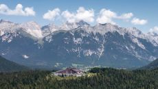 summer exterior from afar at Interalpen Hotel Tyrol