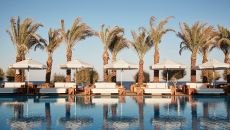 pool loungers at Nikki Beach Resort and Spa Santorini
