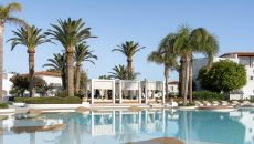 84 caramel pool and palm trees at Caramel A Grecotel Resort to Live